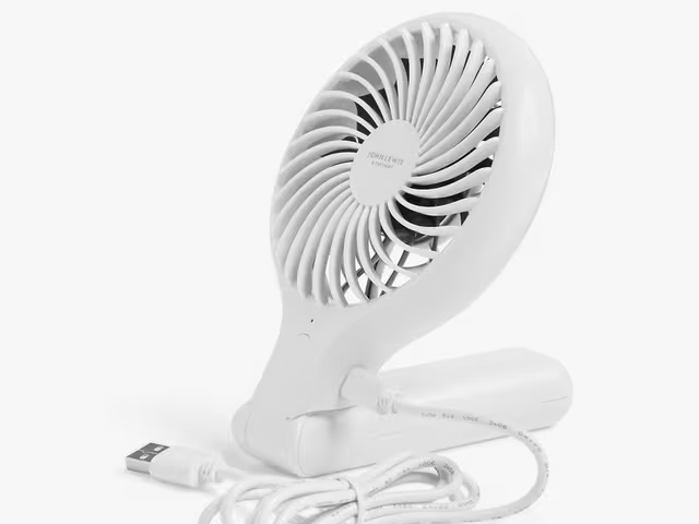 White handheld foldable desk fan with USB cord.