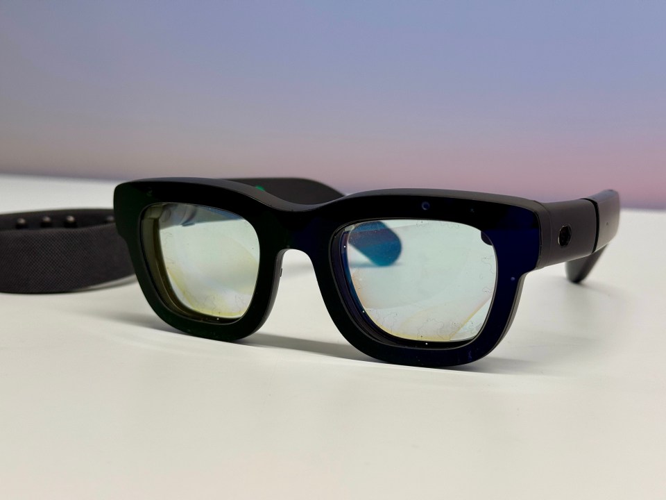 Black smart glasses with a dark band.