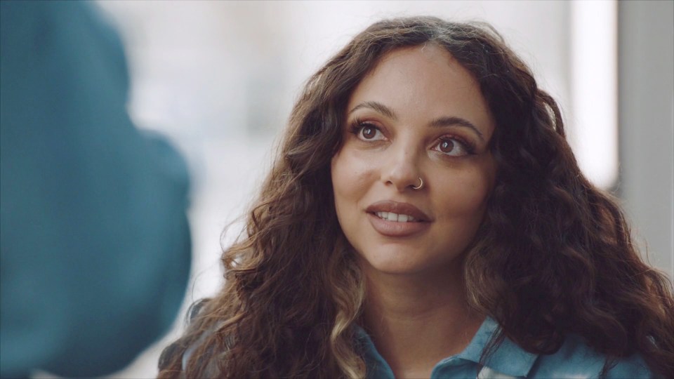 Jade Thirlwall playing a game with a group of people.