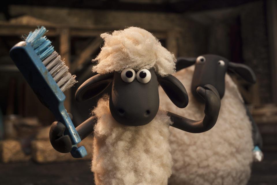 Shaun the Sheep holding a brush.