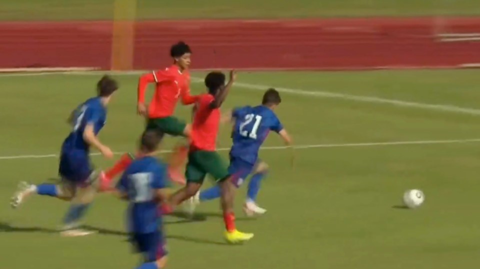 Soccer players vying for the ball.