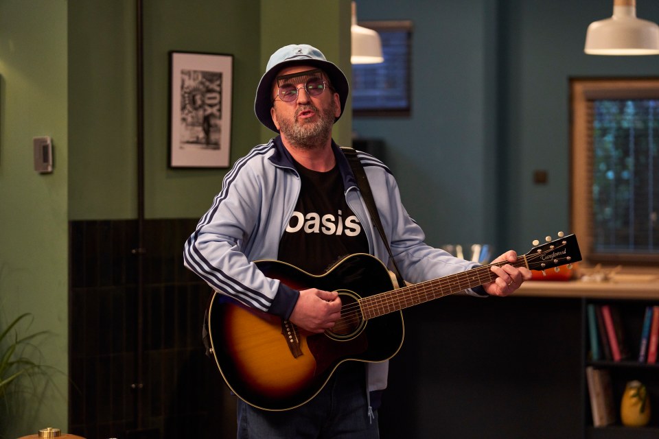 Man playing acoustic guitar.