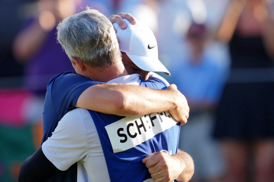 May 18, 2025; Charlotte, North Carolina, USA; Scottie Scheffler celebrates with his caddie Ted Scott after winning the PGA Championship golf tournament at Quail Hollow. Mandatory Credit: Aaron Doster-Imagn Images