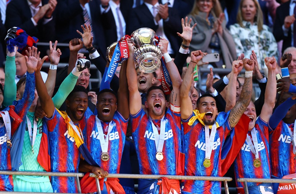 Soccer Football - FA Cup - Final - Crystal Palace v Manchester City - Wembley Stadium, London, Britain - May 17, 2025 Crystal Palace's Marc Guehi and Joel Ward lift the trophy as they celebrate with teammates after winning the FA Cup Action Images via Reuters/Andrew Boyers