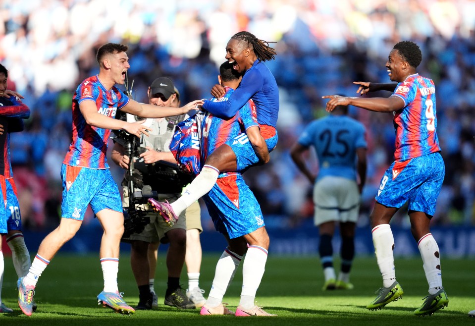 Crystal Palace's Maxence Lacroix (centre left) and Eberechi Eze (centre right) celebrate after the Emirates FA Cup final at Wembley Stadium, London. Picture date: Saturday May 17, 2025. PA Photo. See PA story SOCCER Final. Photo credit should read: Adam Davy/PA Wire. RESTRICTIONS: Use subject to restrictions. Editorial use only, no commercial use without prior consent from rights holder.