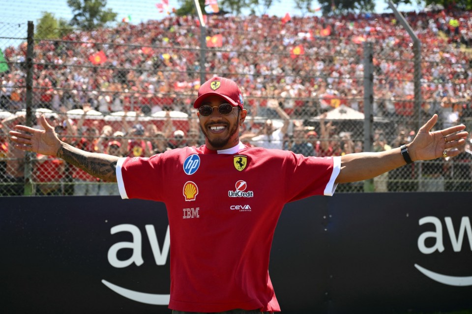 Ferrari's British driver Lewis Hamilton gestures to supporters before the 2025 Emilia Romagna Formula One Grand Prix at the Imola autodrome in Imola, on May 18, 2025. (Photo by Marco BERTORELLO / AFP) (Photo by MARCO BERTORELLO/AFP via Getty Images)
