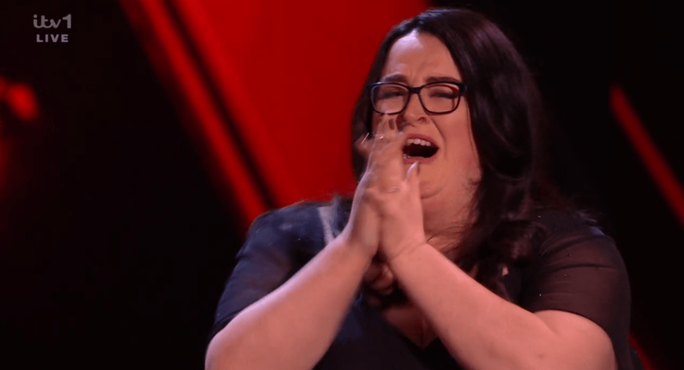 Screenshot of a woman crying and clapping her hands.