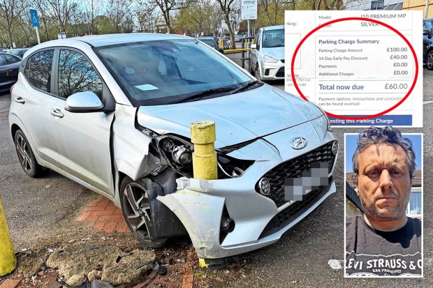 Damaged silver car in parking lot with parking charge notice and driver's photo.
