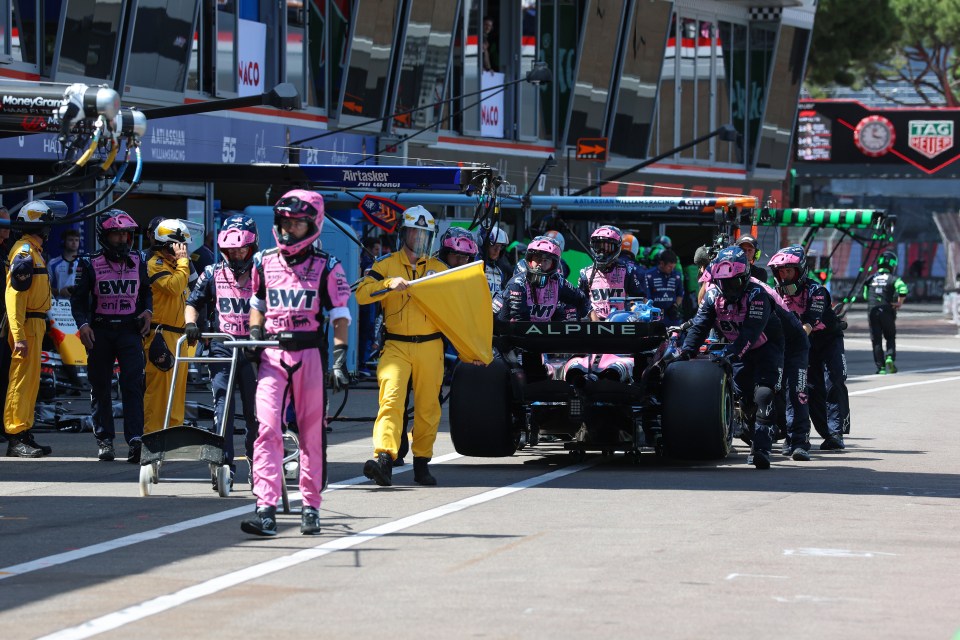 Formula 1 race car in the pit lane.