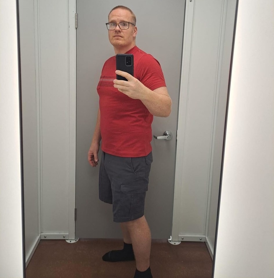 Man taking a selfie in a changing room.
