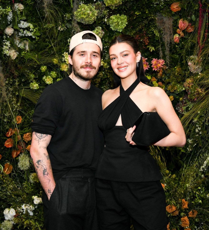 Brooklyn Beckham and Nicola Peltz Beckham at an event.