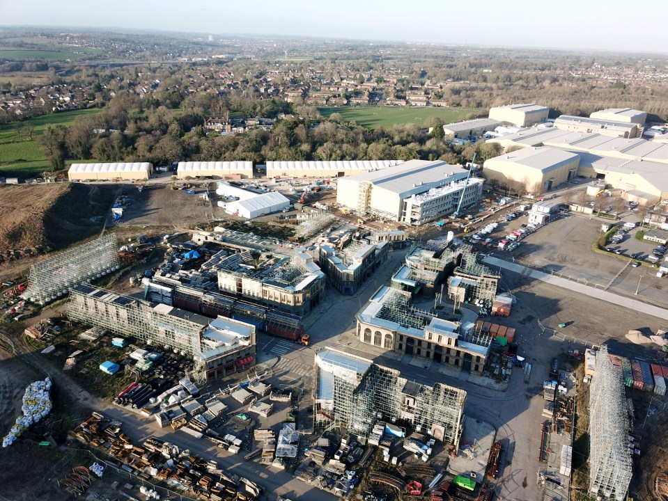 Aerial view of British film studio backlots under construction.