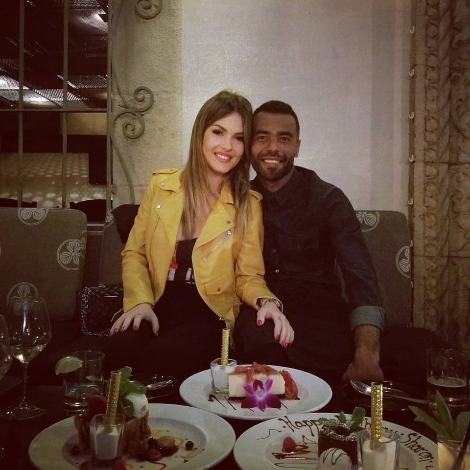 Ashley Cole and Sharon Canu at a restaurant, celebrating with dessert.