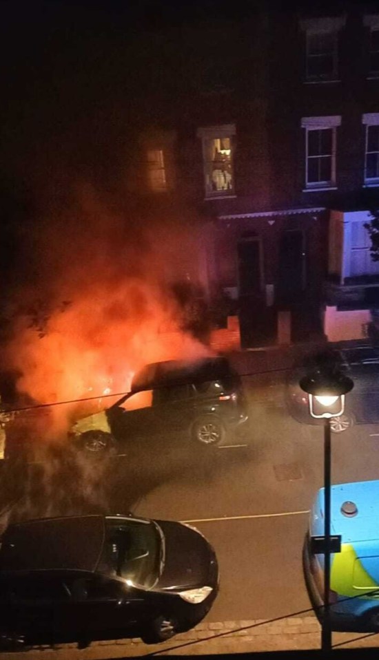 Car on fire at night.