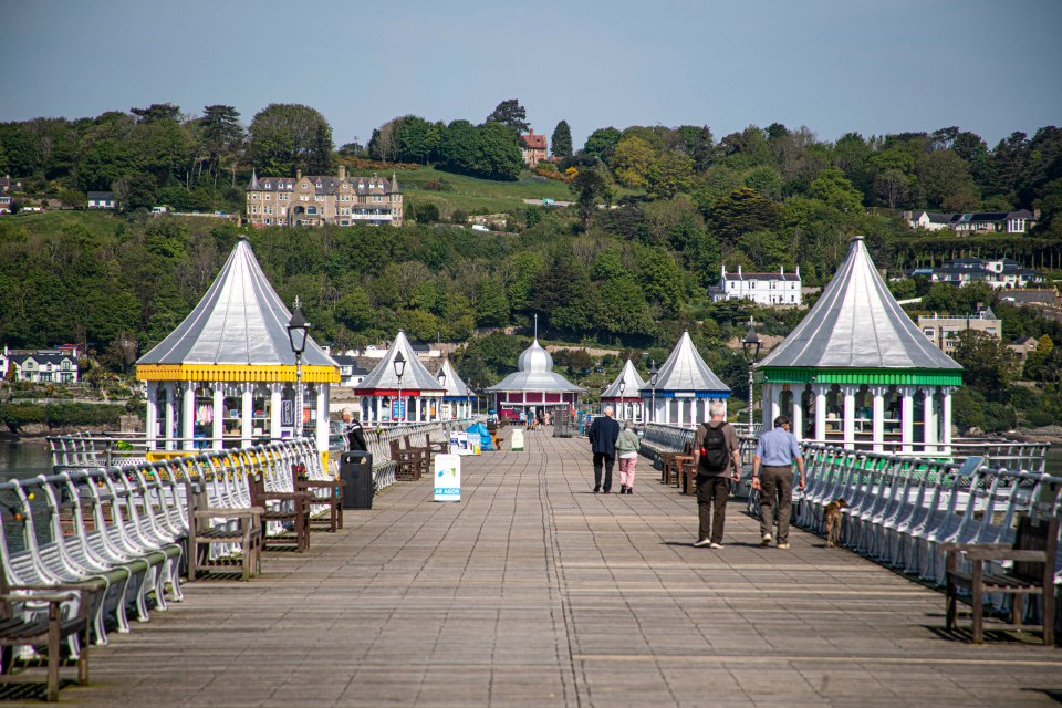People walking on Bangor Pier in Wales.