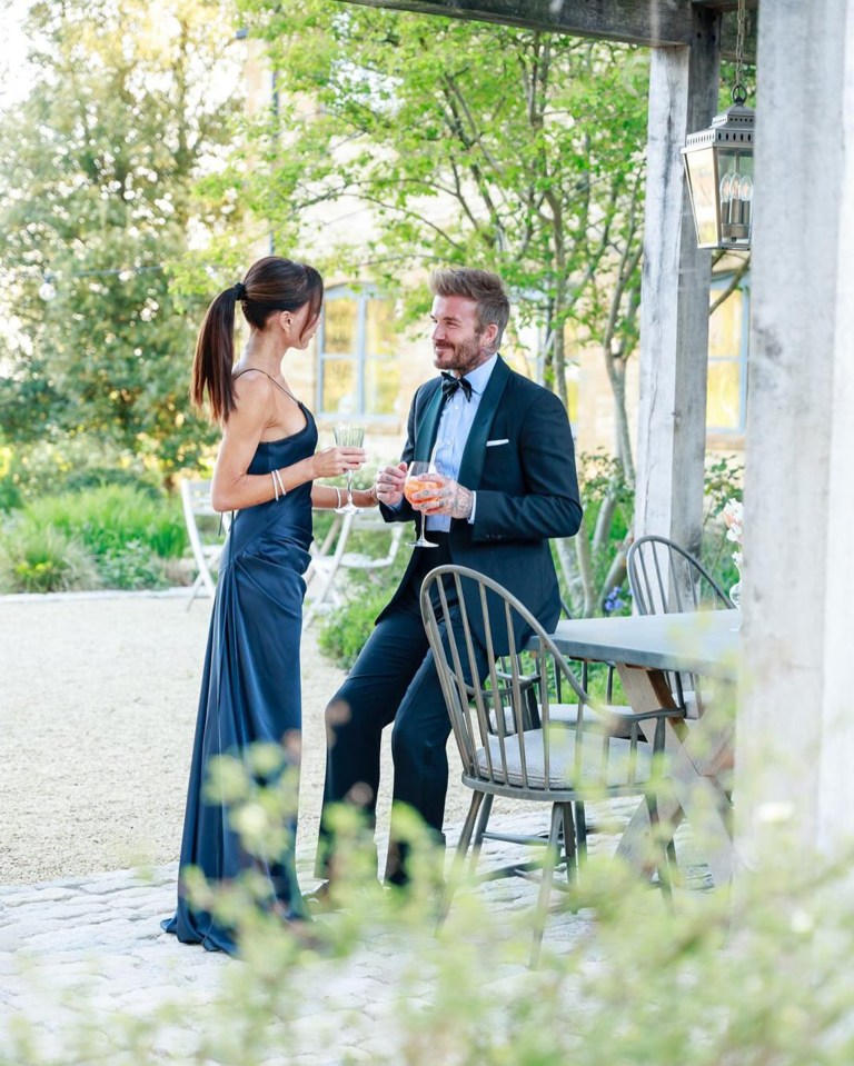 David and Victoria Beckham at a garden party.
