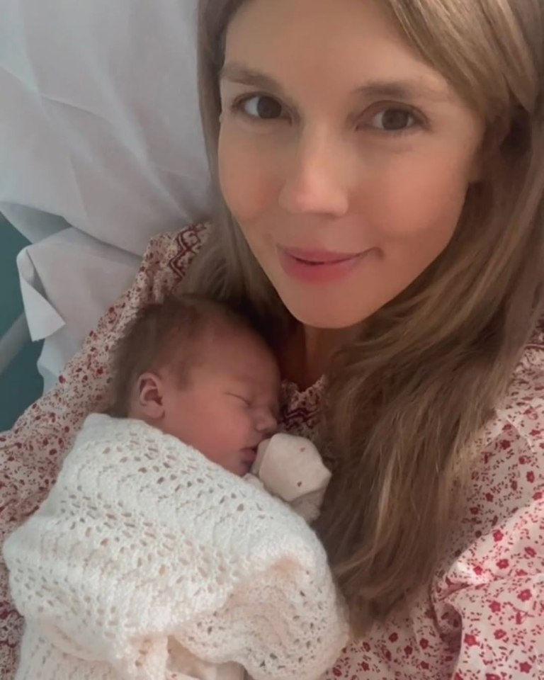 Carrie Johnson holding her newborn baby.