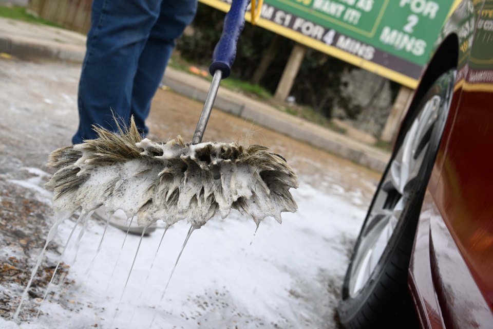 Car wash brush with soap suds.