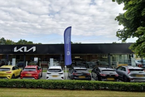 Kia showroom in Warwick with cars on display.
