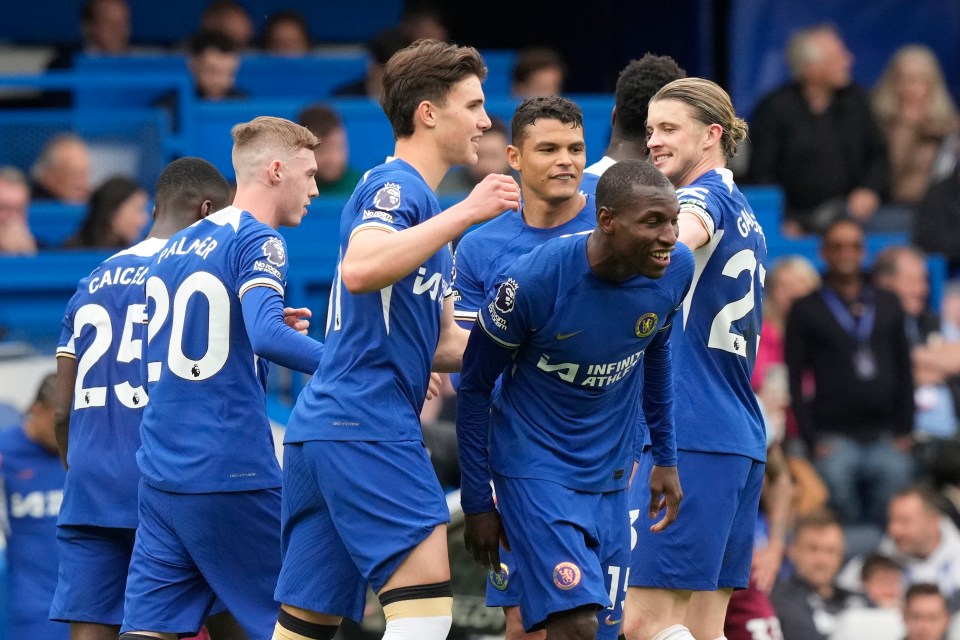 Chelsea soccer players celebrating a goal.