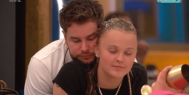 Chris Hughes appearing to look at JoJo Siwa.