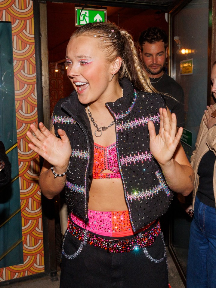 Jojo Siwa leaving a building.
