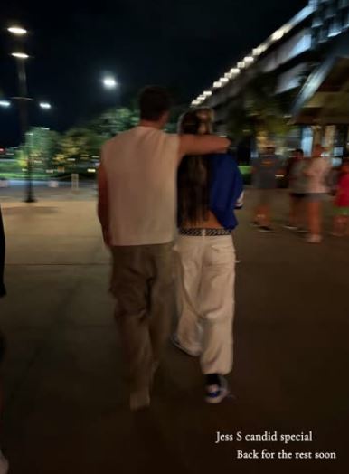 Couple walking at night.