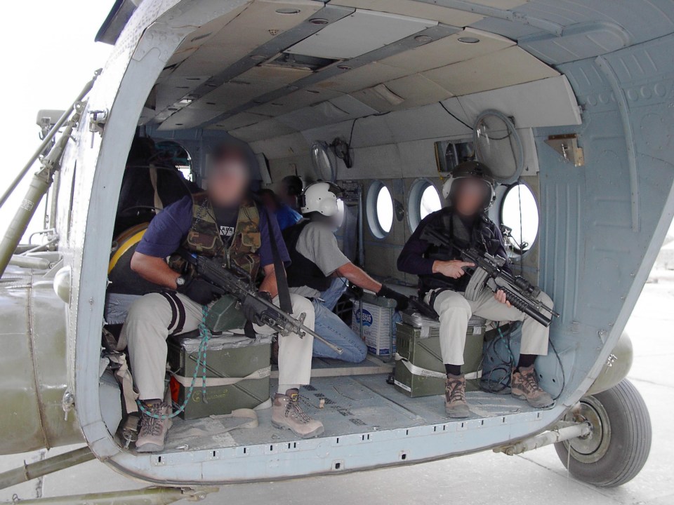 CIA operatives in a helicopter carrying cash to pay Afghan troops.