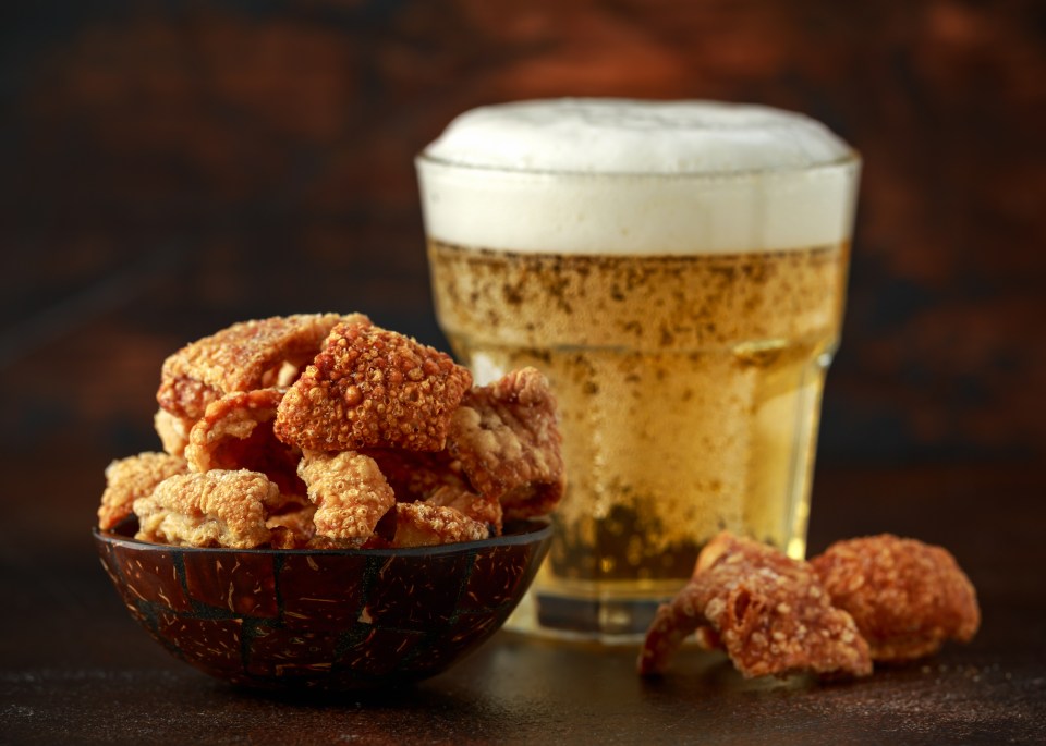 Crispy pork scratchings and a glass of beer.
