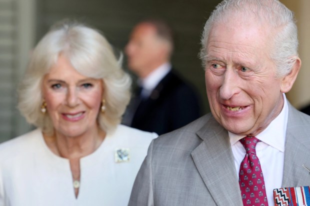 King Charles III and Queen Camilla visiting a market.