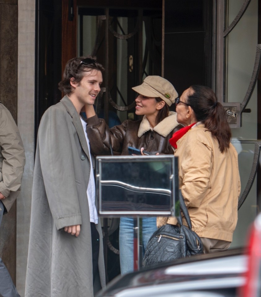 Cruz Beckham with his girlfriend and mother leaving a restaurant.