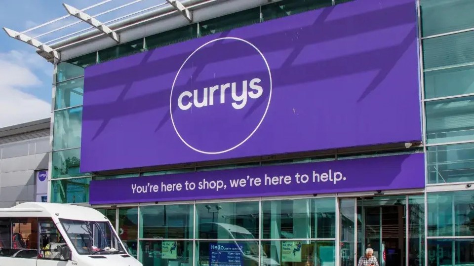 Currys store exterior with signage.