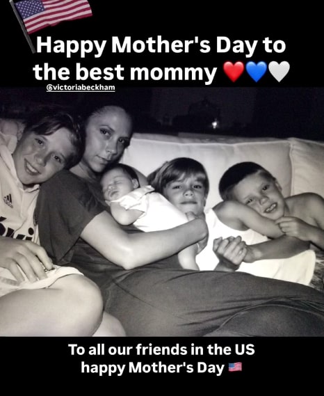 Black and white photo of Victoria Beckham with her four sons.