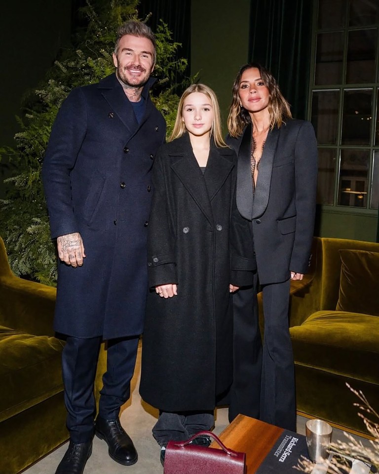 David, Harper, and Victoria Beckham at a celebration.