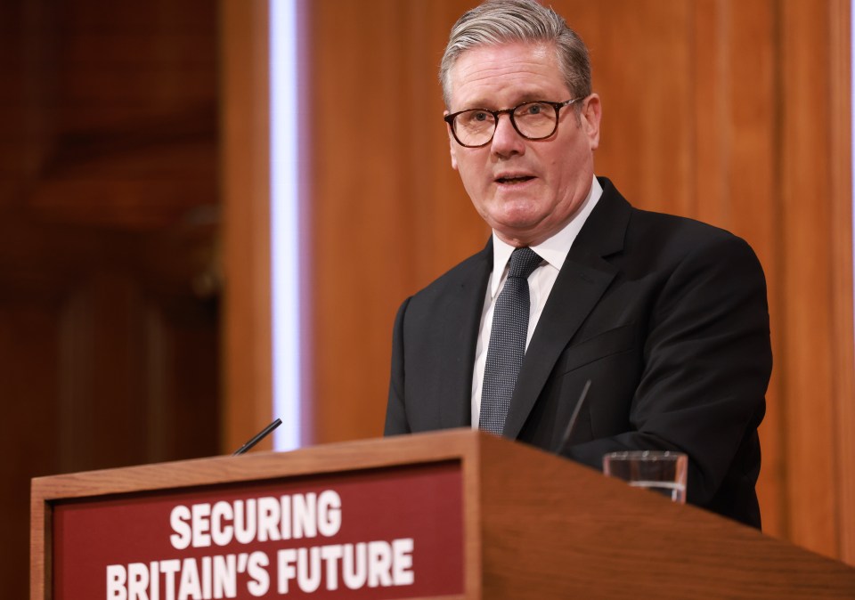 Keir Starmer giving a press conference on immigration.