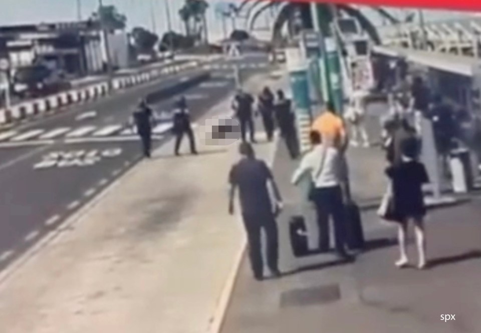 Police officers shooting a man at an airport.
