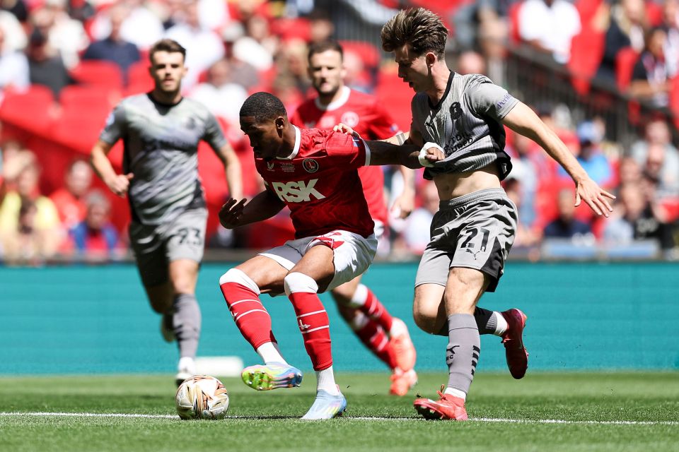 Soccer players on a field during a game.