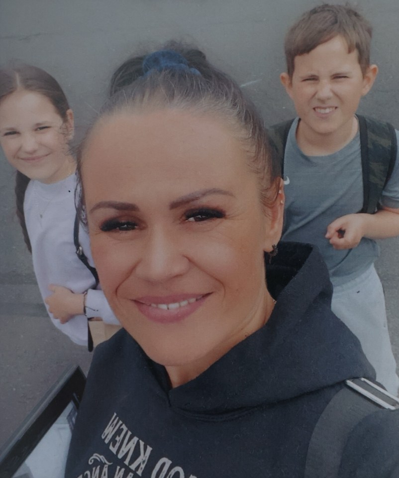 Photo of a mother with her daughter and son.