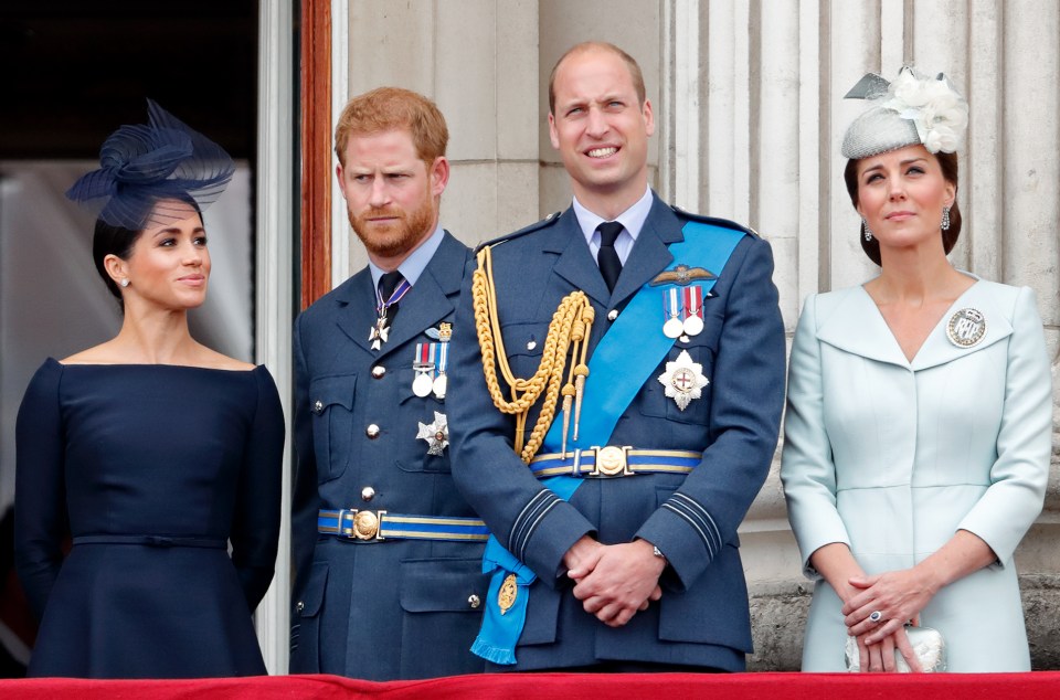 Meghan, Harry, William, and Kate watching a Royal Air Force flypast from Buckingham Palace.