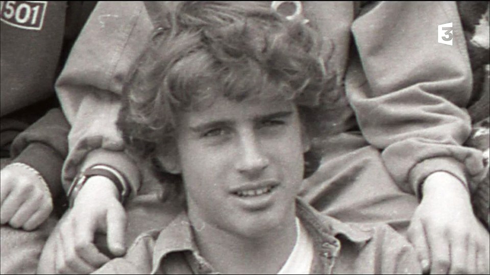 Young Emmanuel Macron kissing Brigitte Trogneux on the cheek.