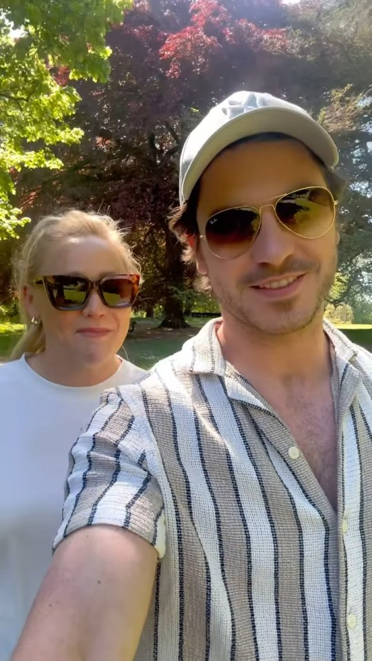 Amy Walsh and her husband in a park.