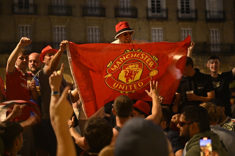 Manchester United fans celebrating.