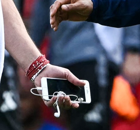 Nottingham Forest's manager and co-owner talking on the pitch.