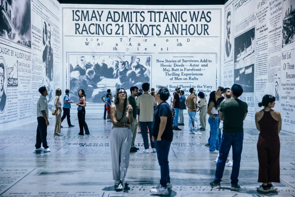 A first-of-its-kind Titanic exhibition featuring large-scale newspaper print reproductions and visitors.