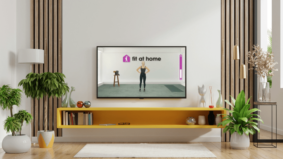 Television screen showing a woman doing a home workout.