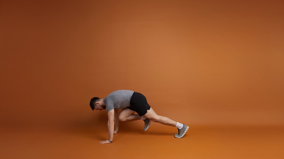 Man performing mountain climbers exercise.