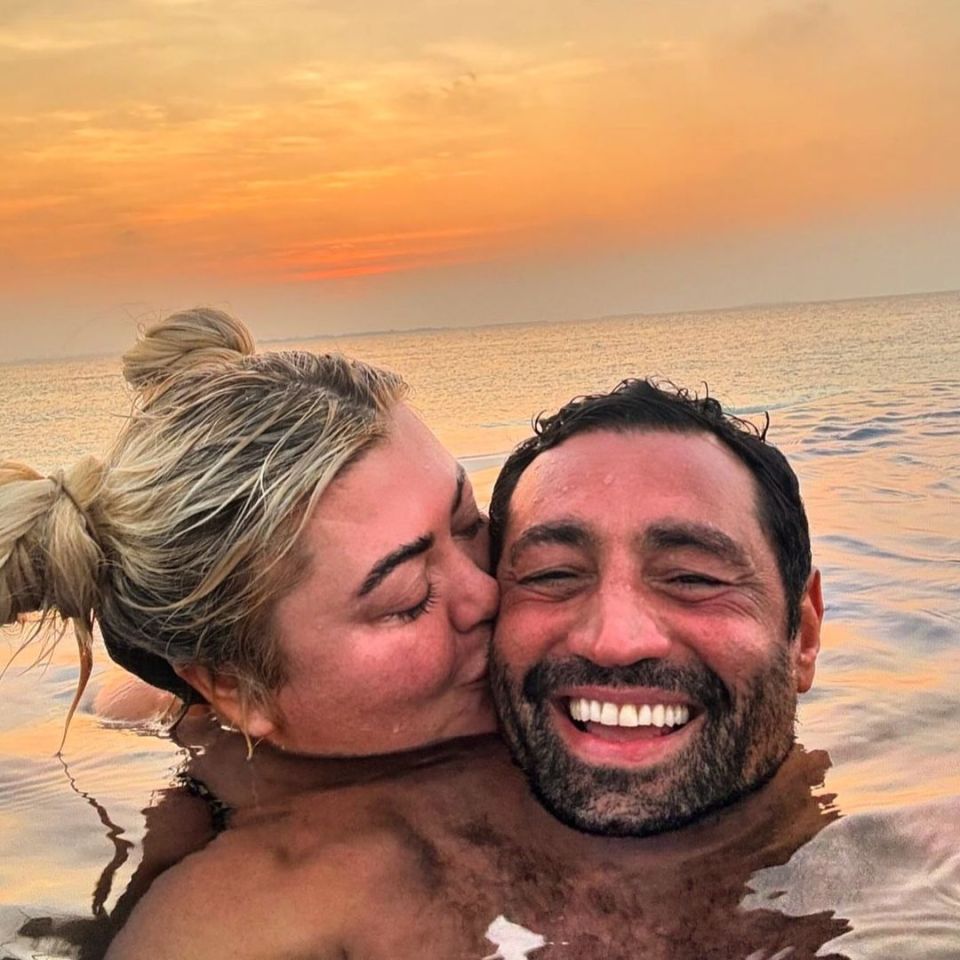 Gemma Collins kissing her fiancé Rami at sunset.