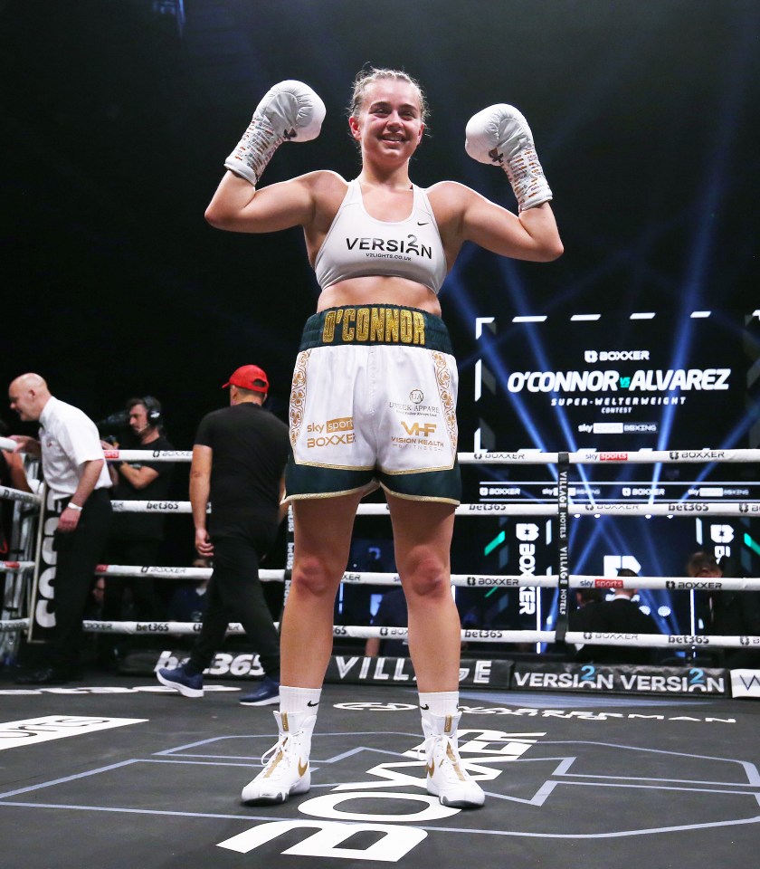 Georgia O'Connor celebrates a super-welterweight boxing victory.