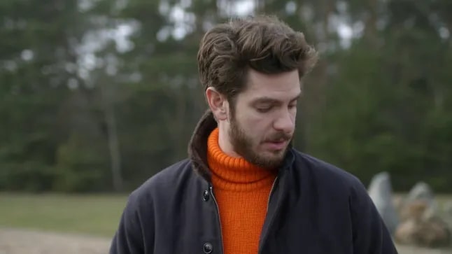 Andrew Garfield appearing emotional.