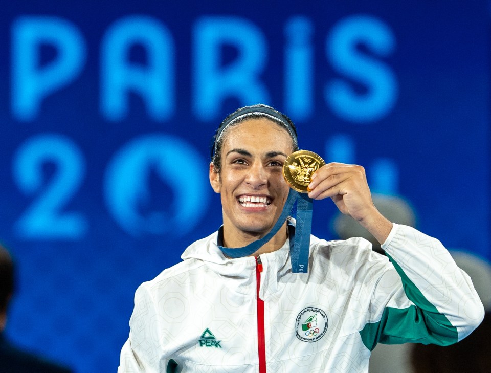 Algerian boxer Imane Khelif celebrates her gold medal win.